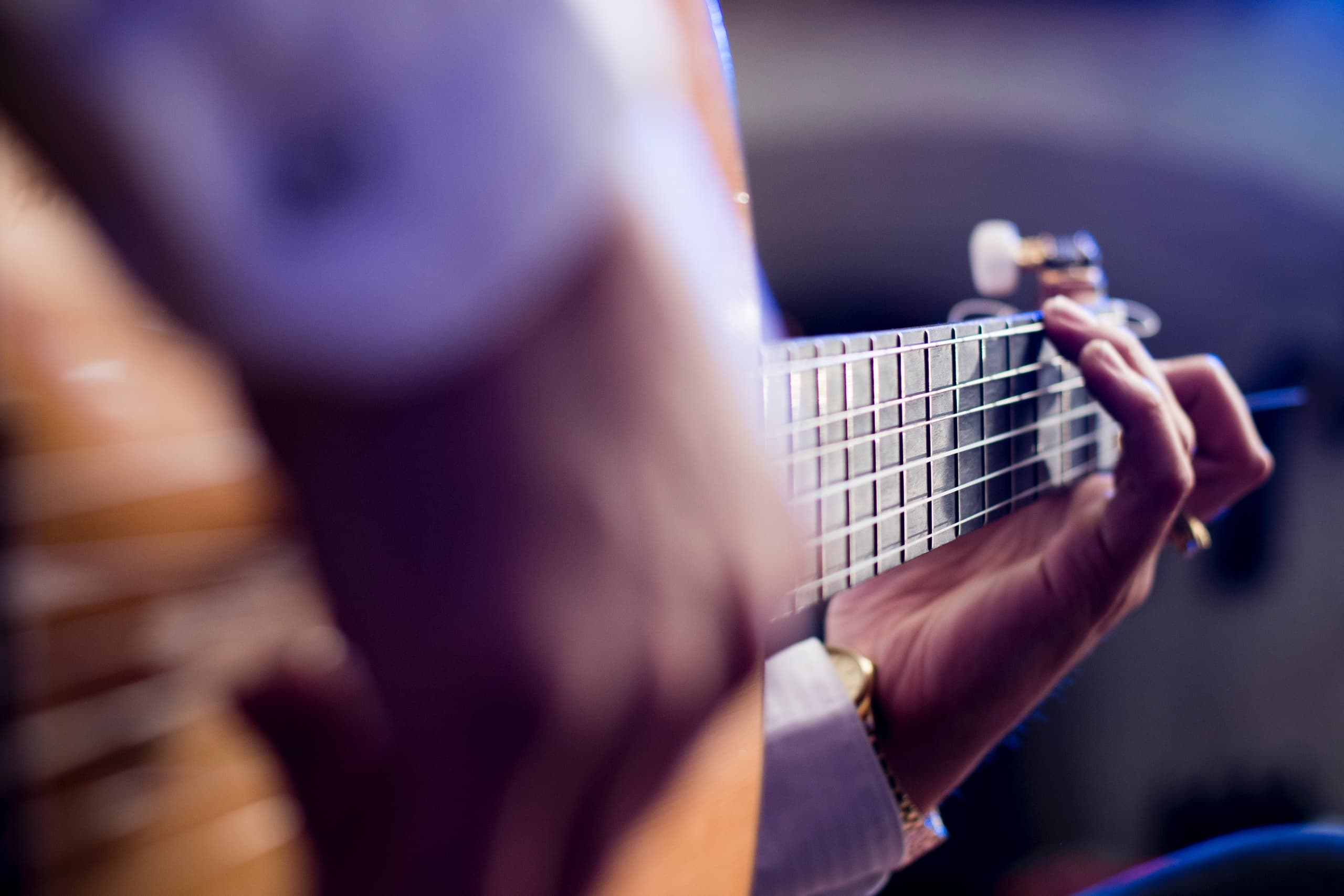 Classical guitarist playing acoustic guitar in cave tablao