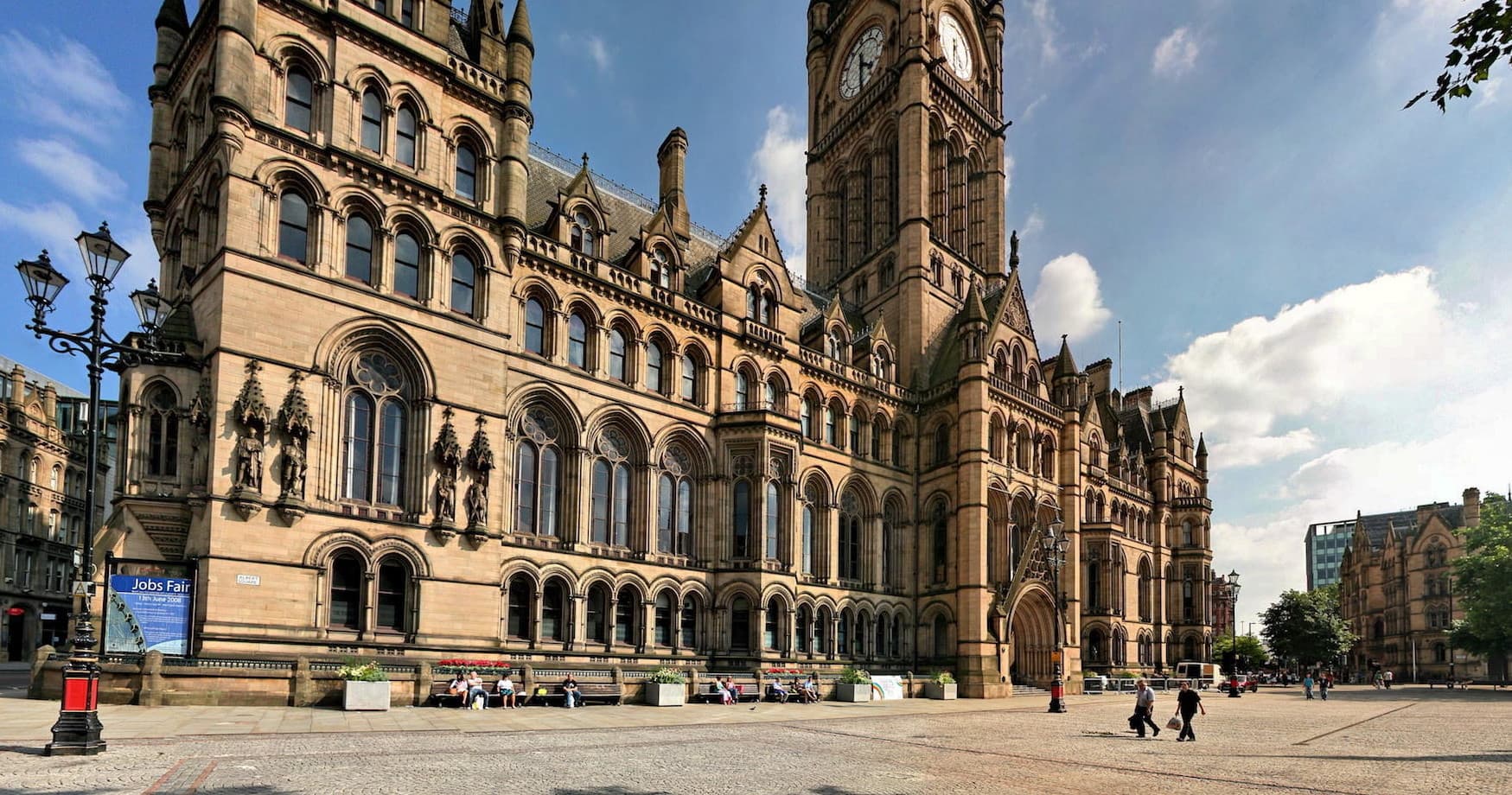 Gothic town hall facade, architectural walking tour in city square