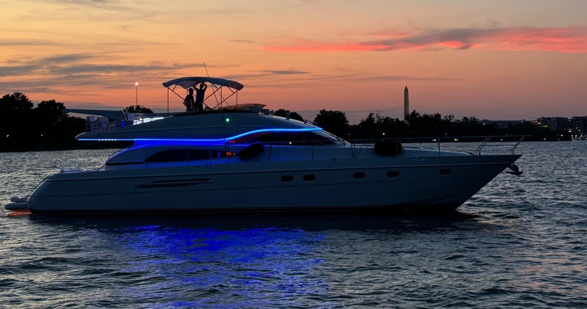 Luxury yacht cruising at sunset on calm coastal waters