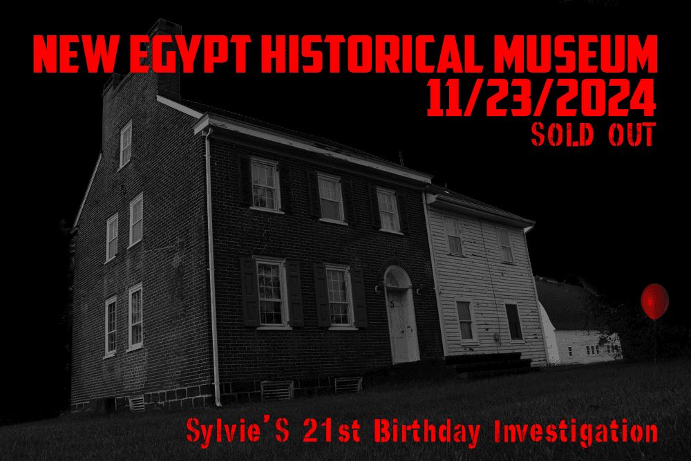 Haunted historical museum exterior at night for guided paranormal tour