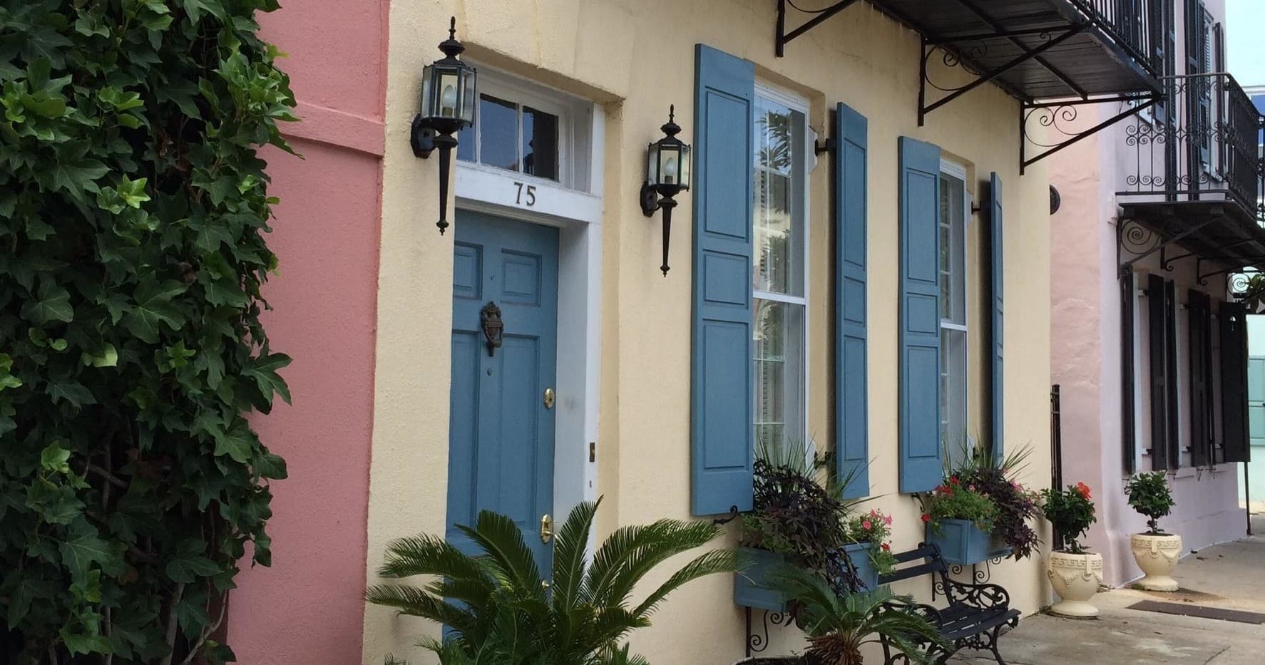 Colorful rowhouse facades and shutters on Charleston walking tour