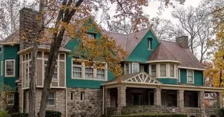 Historic mansion exterior for scenic self-guided tour on autumn grounds