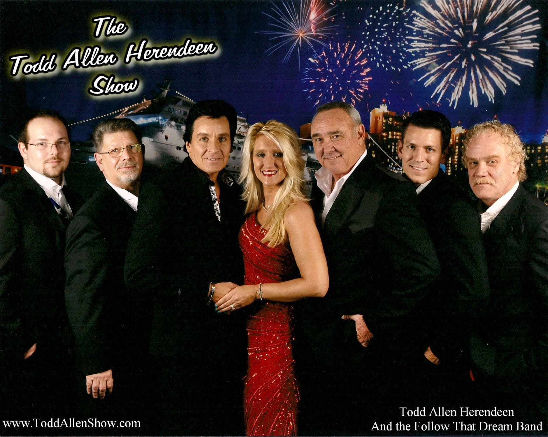 Band posing with fireworks backdrop for indoor stage show