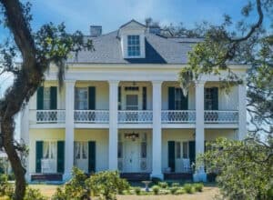 Front façade of St. Joseph Plantation manor with columns and shutters