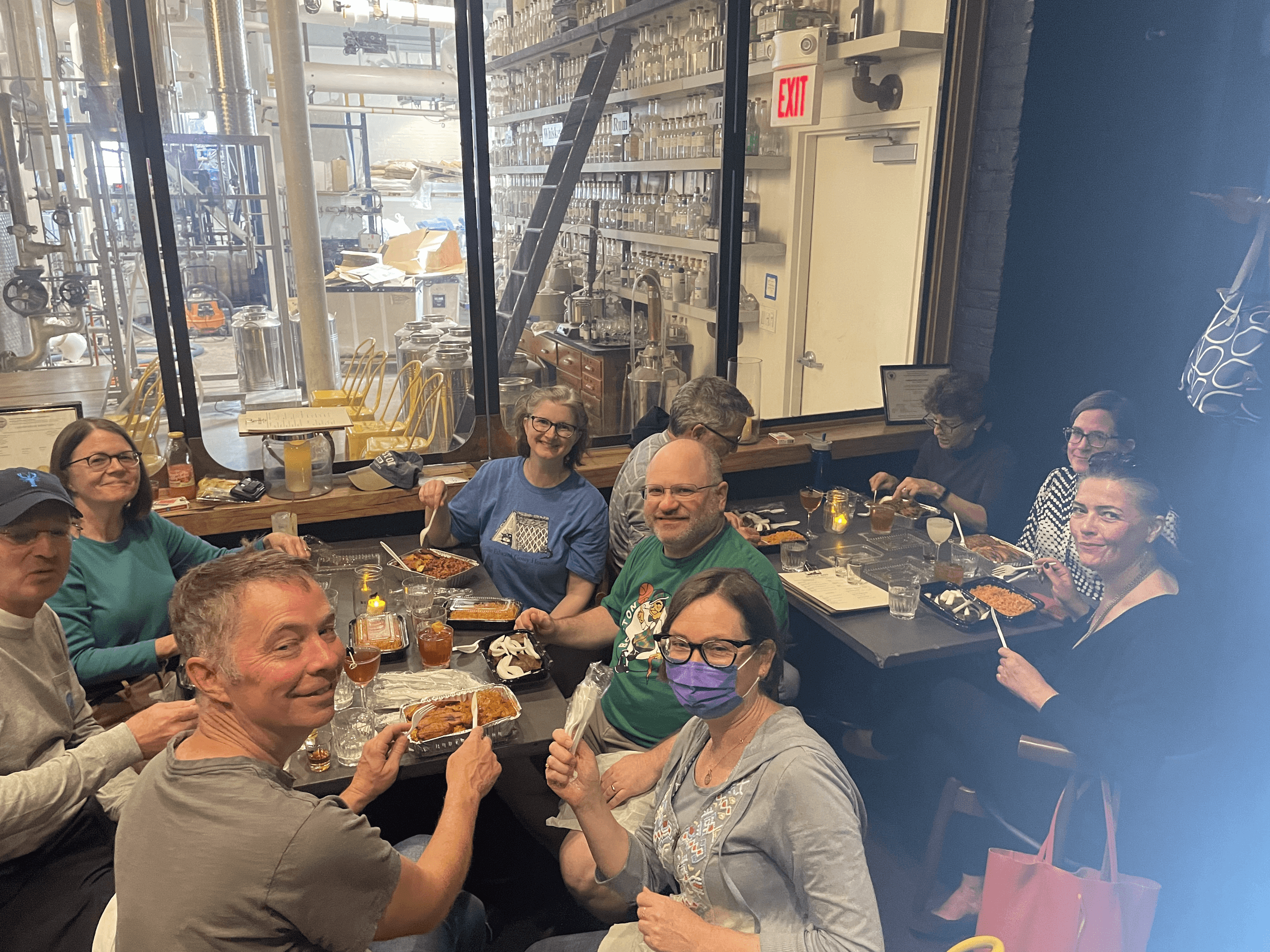 Group enjoying craft brewery meal inside Boston tavern