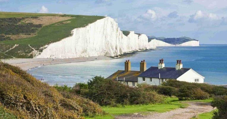 White chalk cliffs and seaside cottages for coastal cliff walks