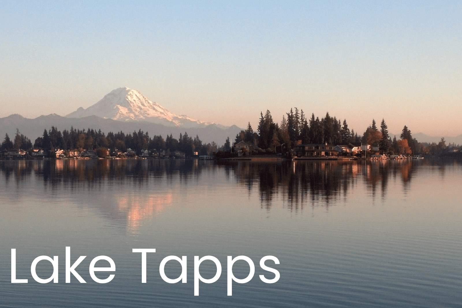 Paddleboarding on Lake Tapps with Mount Rainier reflection