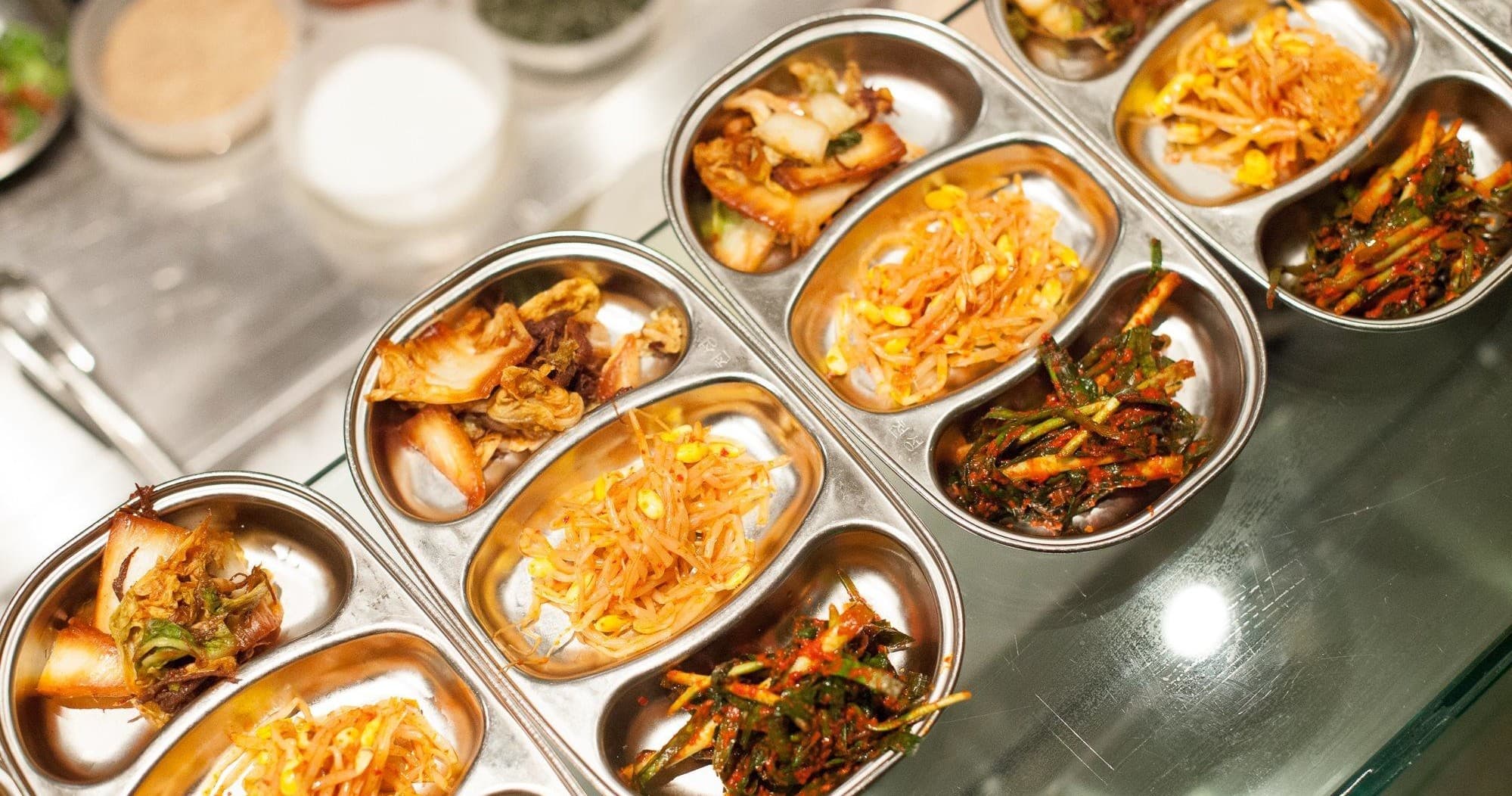 Assorted plated dishes on buffet line showcasing diverse cuisine