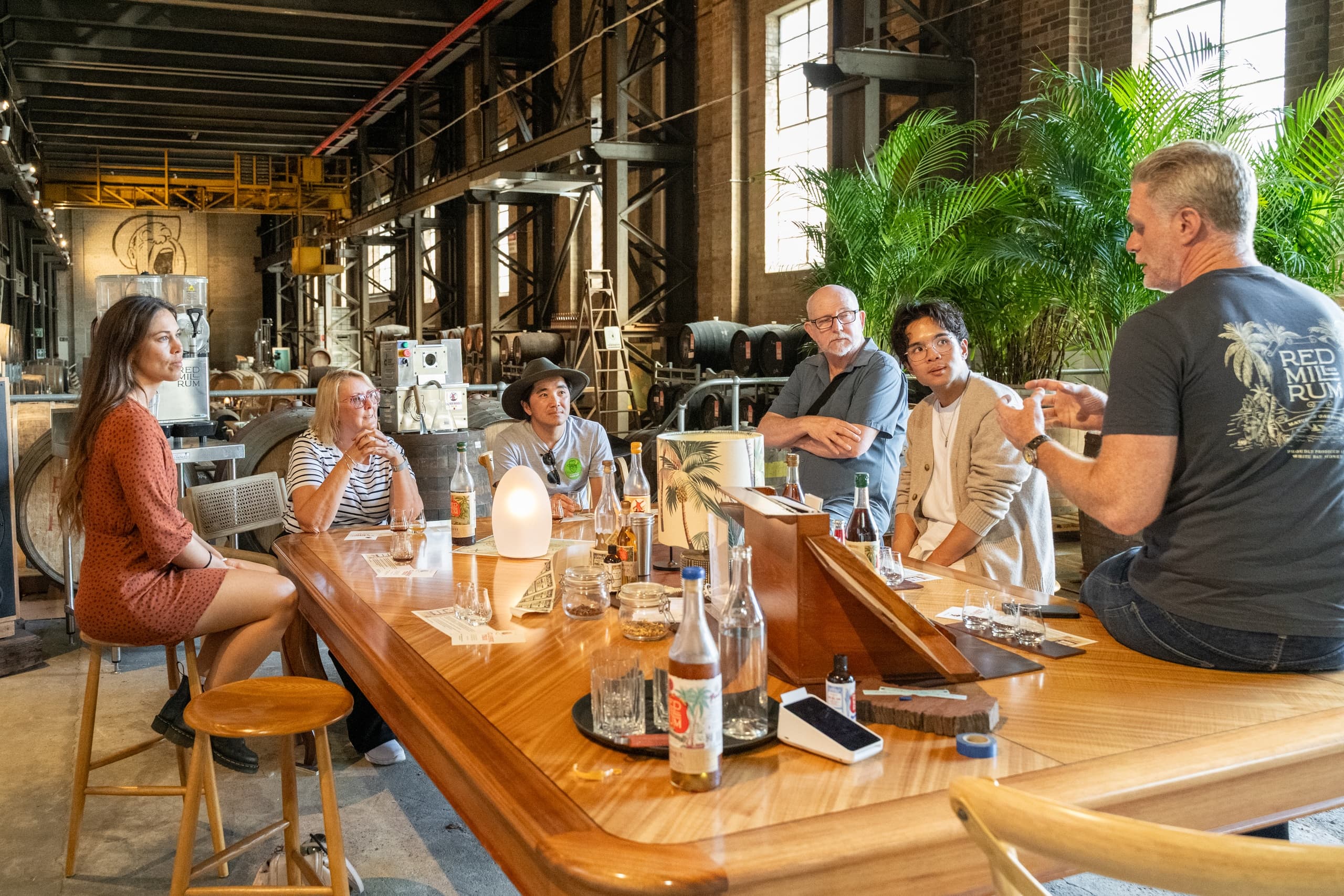 Indoor craft brewery tasting with guests seated at bar