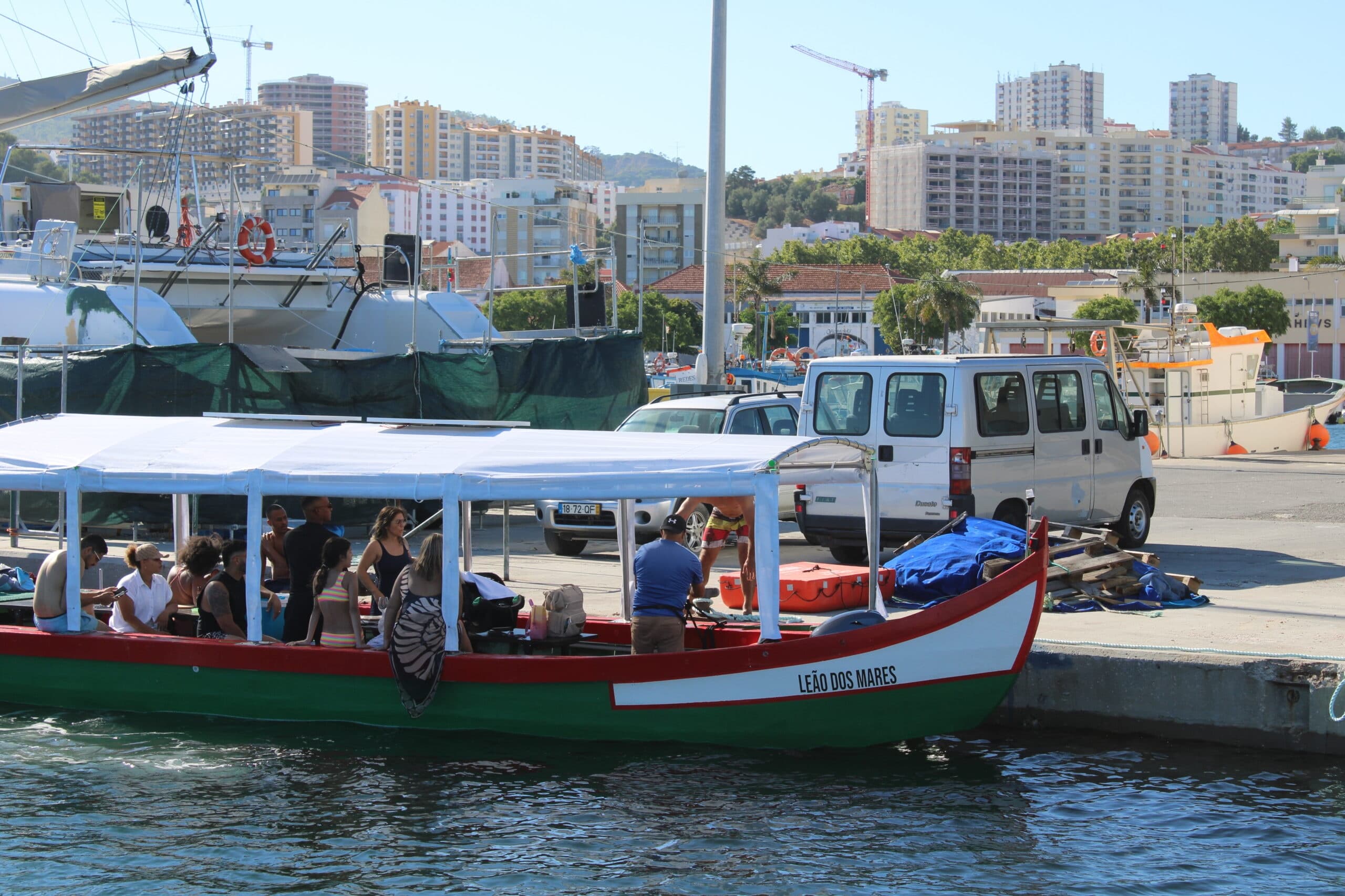 Harbor tour boat with passengers docked, coastal sightseeing