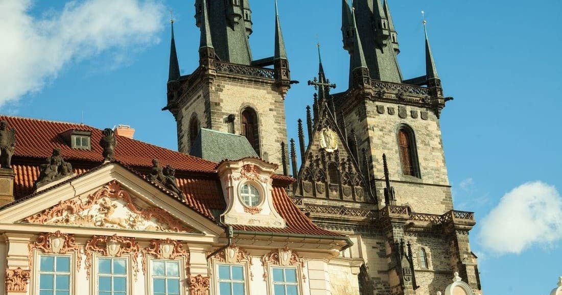 Towers of Church of Our Lady before Týn rising above Prague roofs
