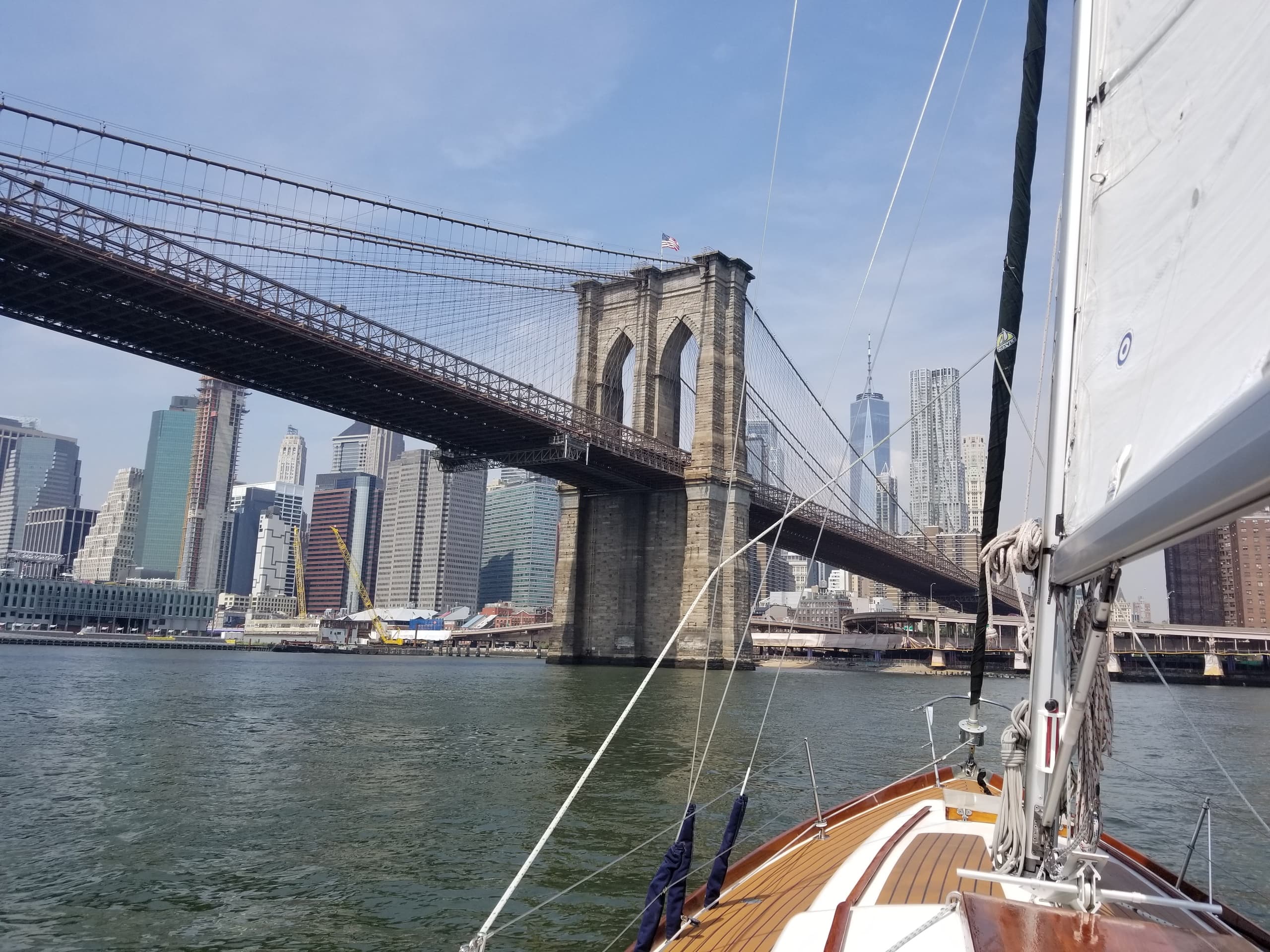 Sailing past Brooklyn Bridge in New York Harbor, cruising