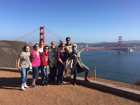 Group at Golden Gate Bridge overlook during San Francisco coastal hike