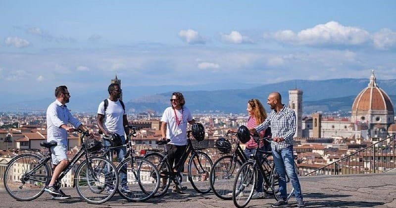 Group bike tour above Florence skyline with Duomo view