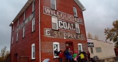 Historic Willoughby Coal building exterior with visitors