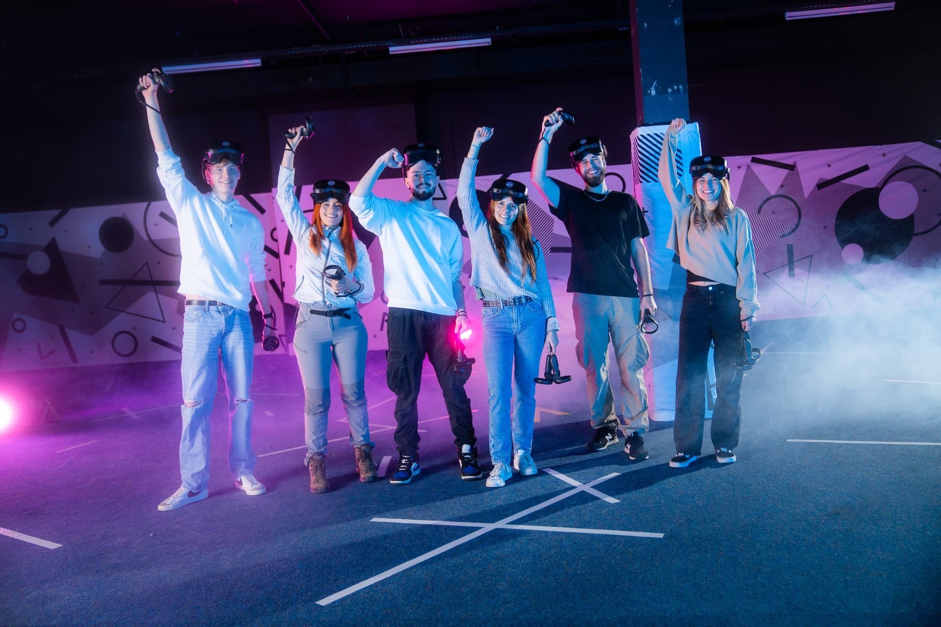 Group of friends celebrating outdoors with VR headsets