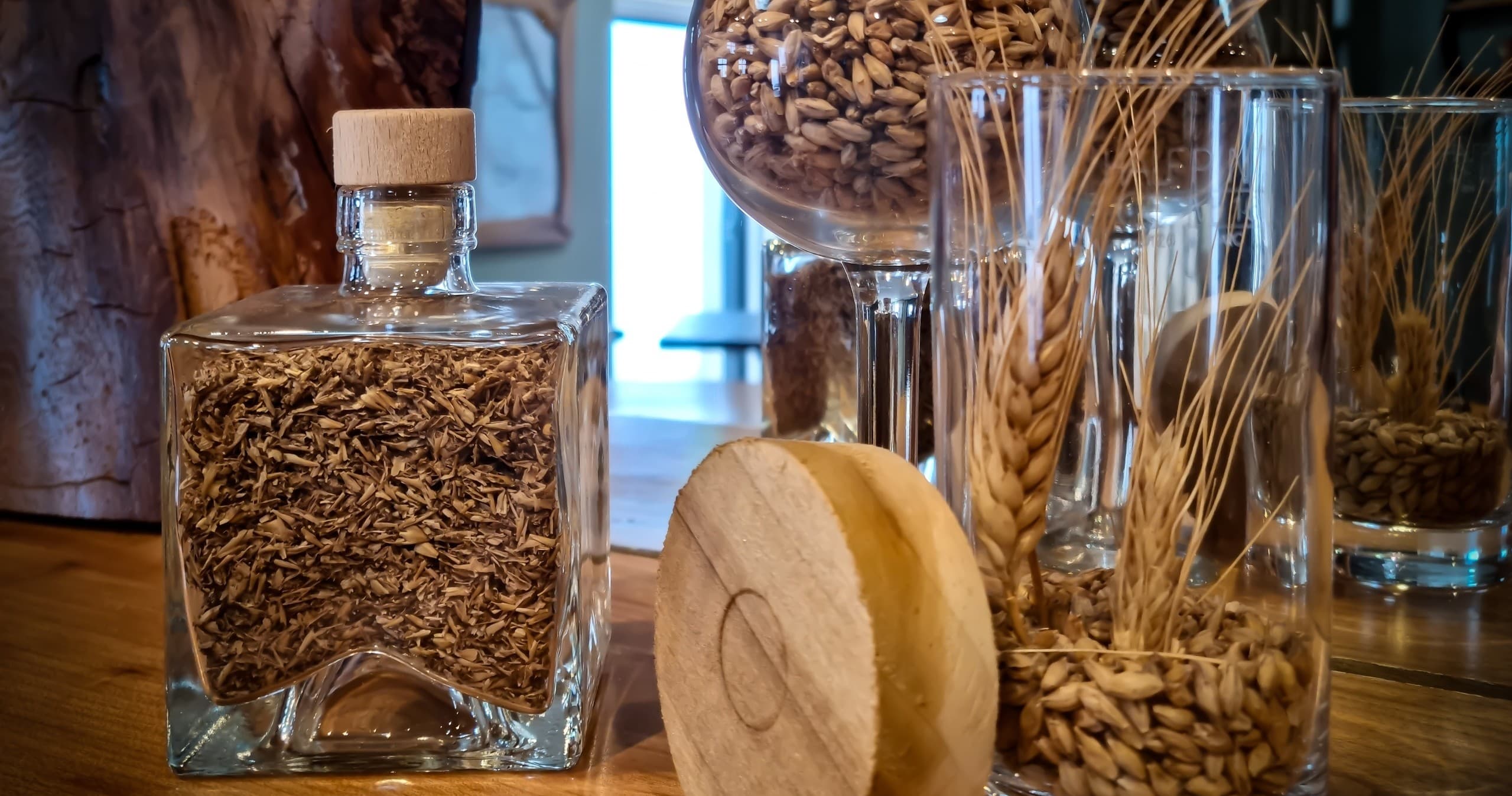 Malted barley and grains displayed at distillery malting demonstration