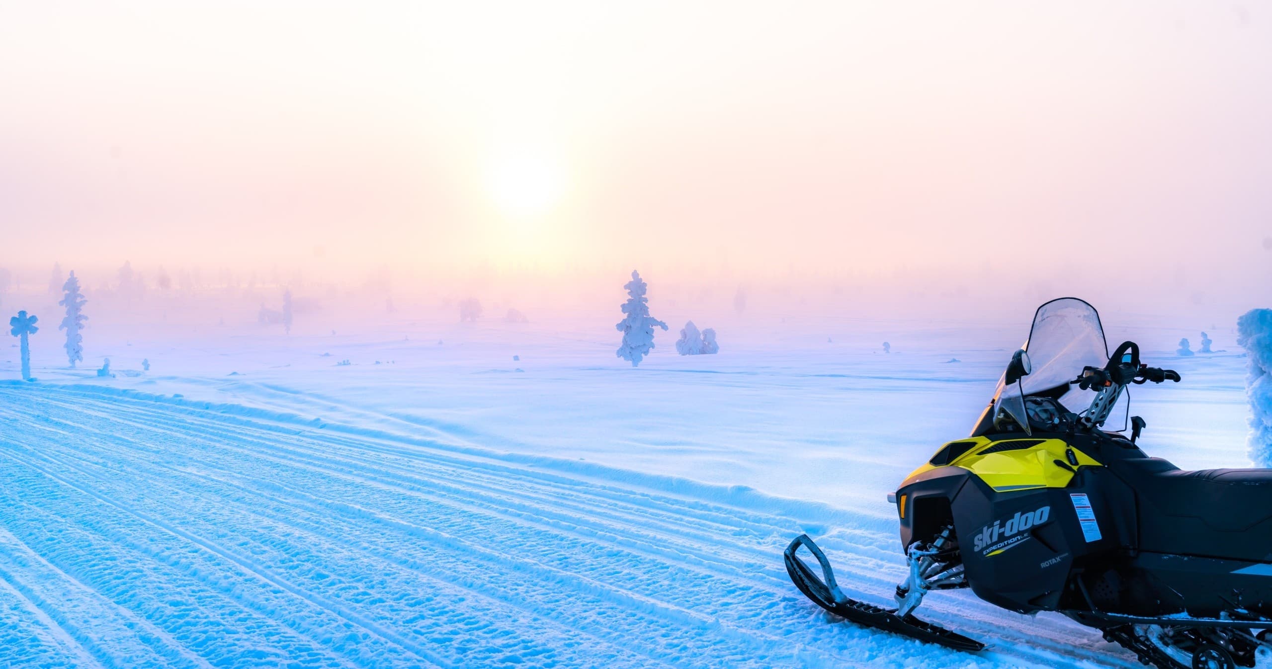Winter Sports at Northern Lights Village Pyhä: Snowmobiling Adventure