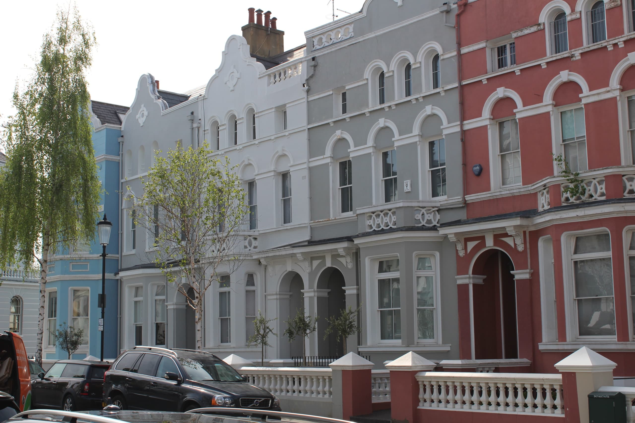 Elegant Kensington townhouses along tree-lined London street tour
