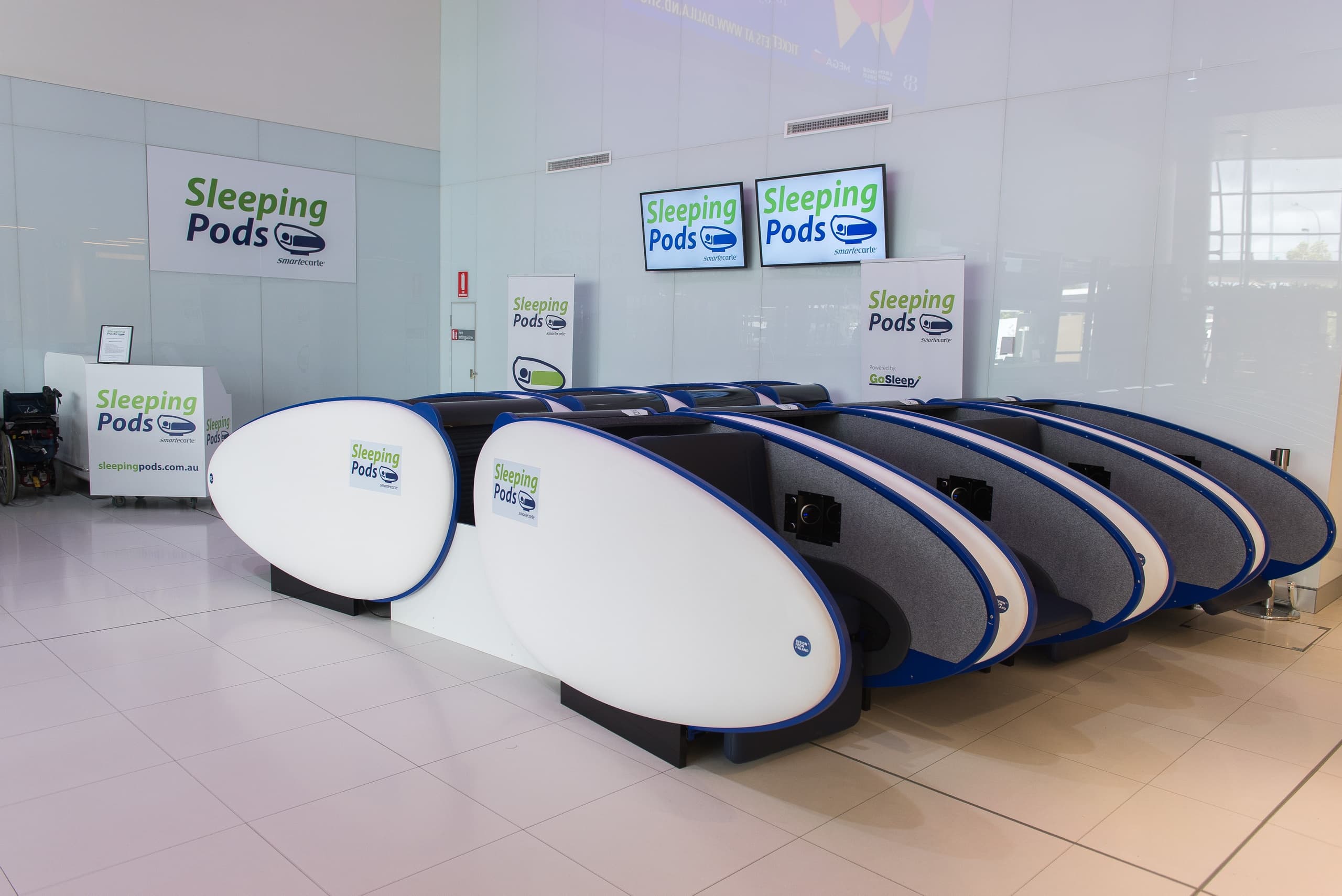 Multiple airport sleeping pods at terminal kiosk for travelers
