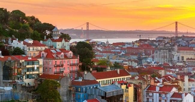 Panoramic Lisbon cityscape at sunset overlooking the Tagus