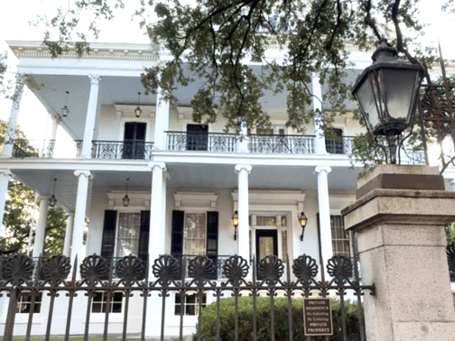 Antebellum mansion exterior with colonial columns on historic tour