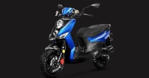 Blue motor scooter on dark studio backdrop for urban rental
