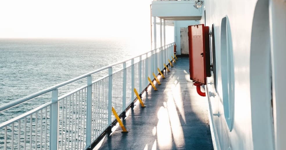 Ferry deck walkway with ocean views during coastal boat tour