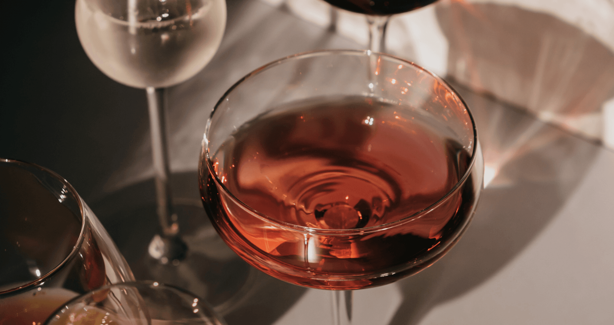 Rosé wine glass closeup at Lisbon waterfront tasting table