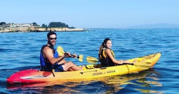 Two kayakers paddling in bright coastal waters at Elkhorn Slough