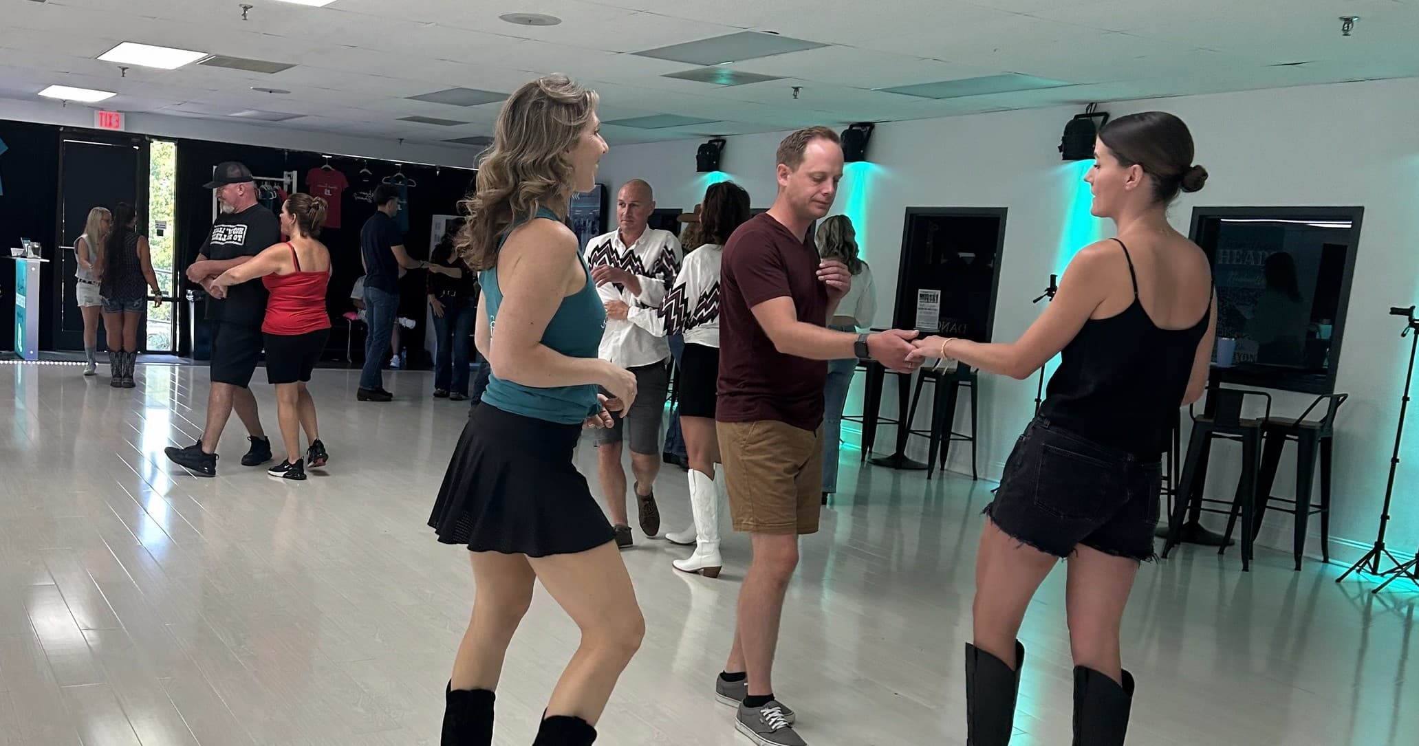 Partners dancing in country dance studio class indoors
