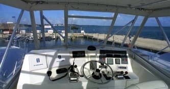 Boat helm and navigation console at docked sportfisher vessel