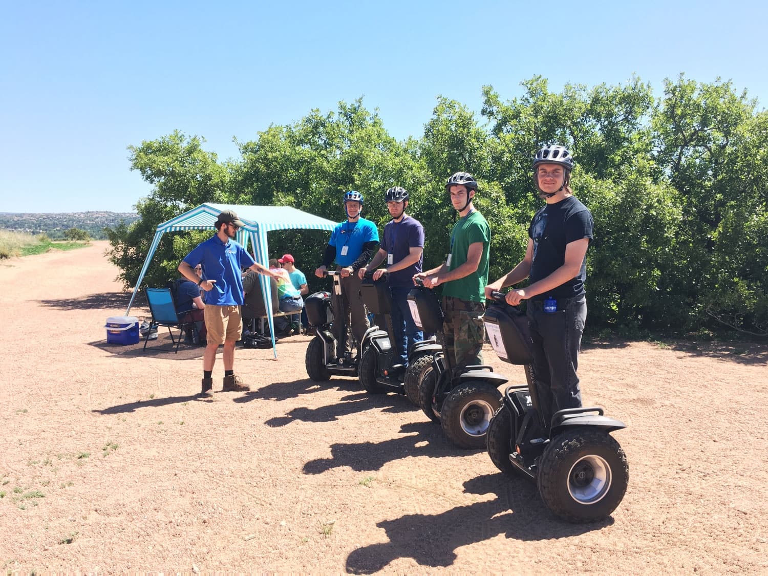 Group on Segway tour under clear sky at Cheyenne Canyon trail