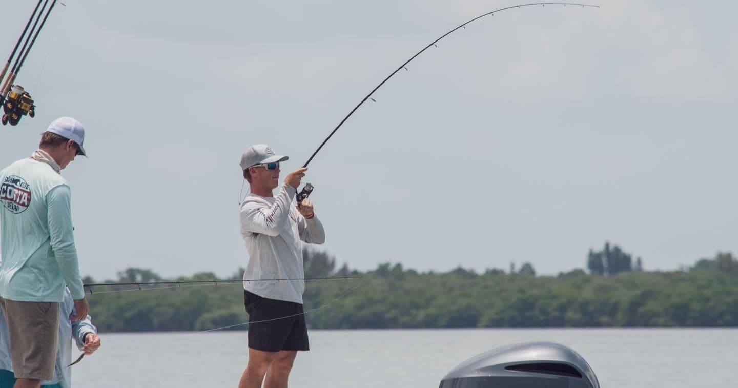 Anglers casting from a sportboat inshore near Tampa Bay