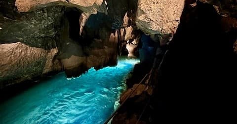 Underground cave with turquoise grotto pool, guided cave exploration