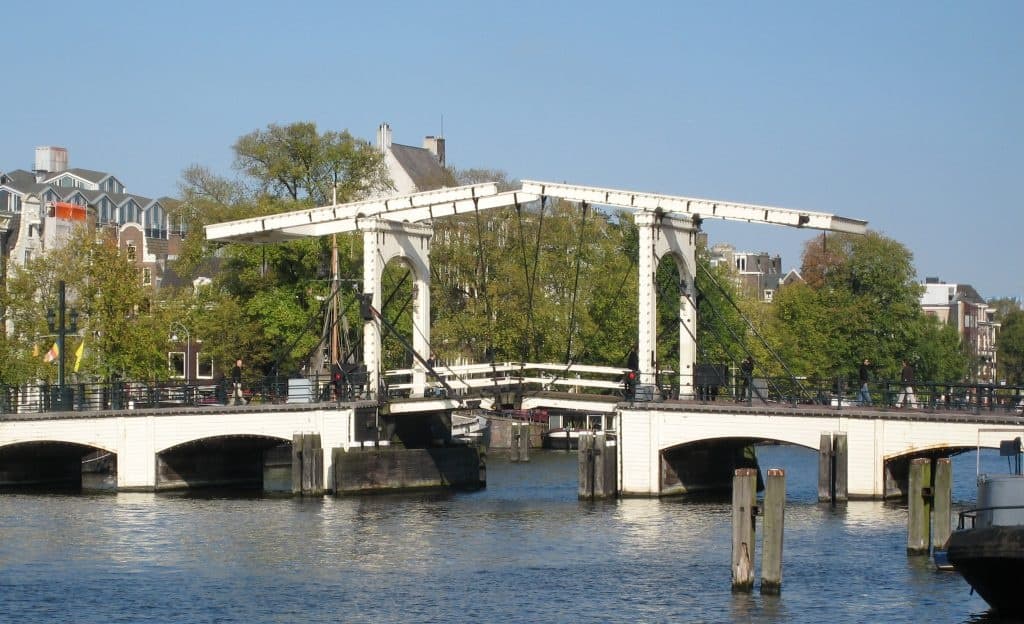 Scenic Amsterdam drawbridge over canal near historic waterfront