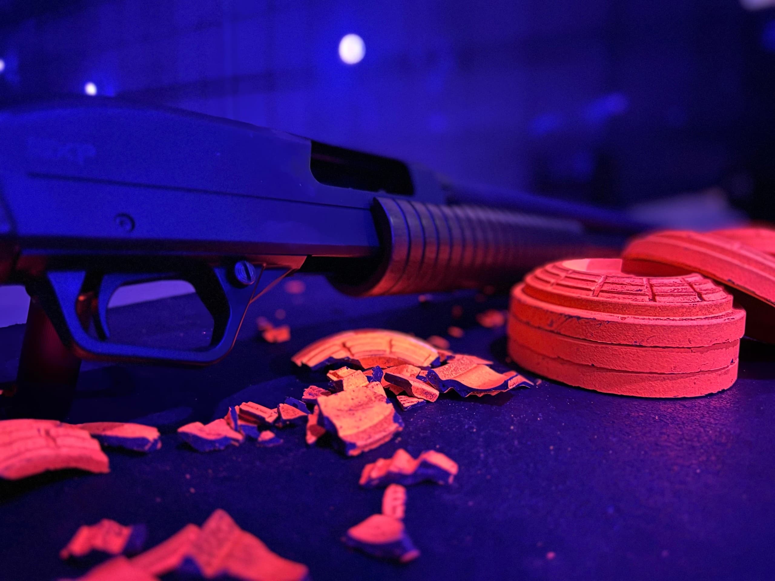 Blacklight Clay Pigeon Shooting in Murray: TNT's 60-Minute Indoor Group Experience