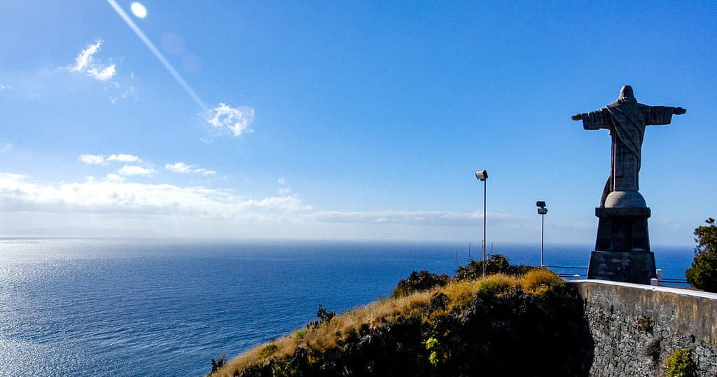 Cliffside viewpoint with statue overlooking Atlantic, Madeira hike