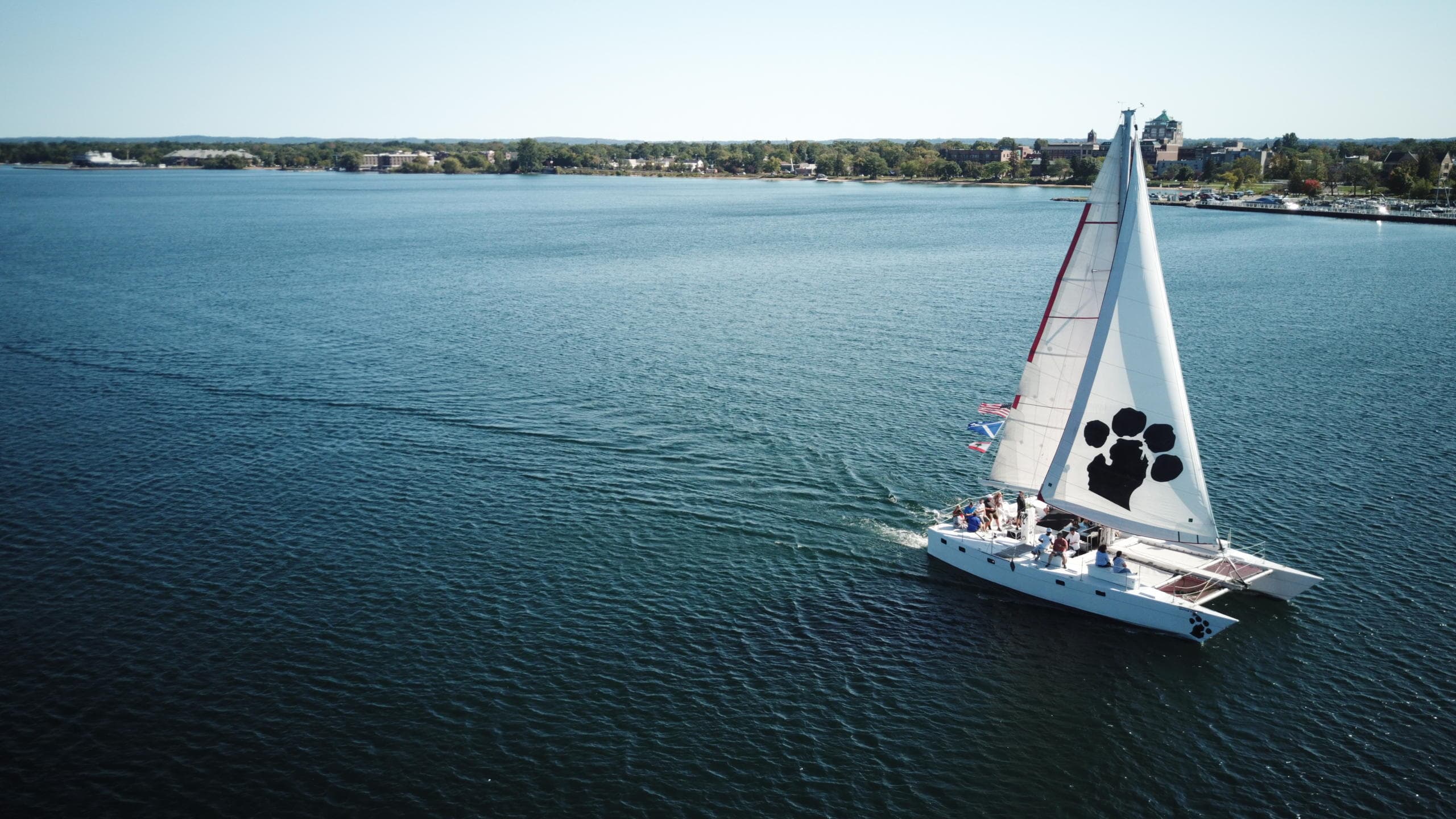 Sailboat cruising on calm coastal waters, scenic summer sailing