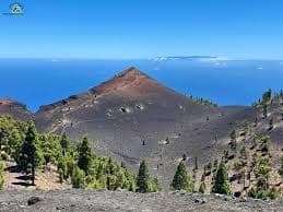 Scenic volcanic peak and forested slopes overlooking ocean La Palma