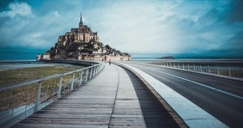 Walk along causeway to Mont Saint-Michel, coastal Normandy view