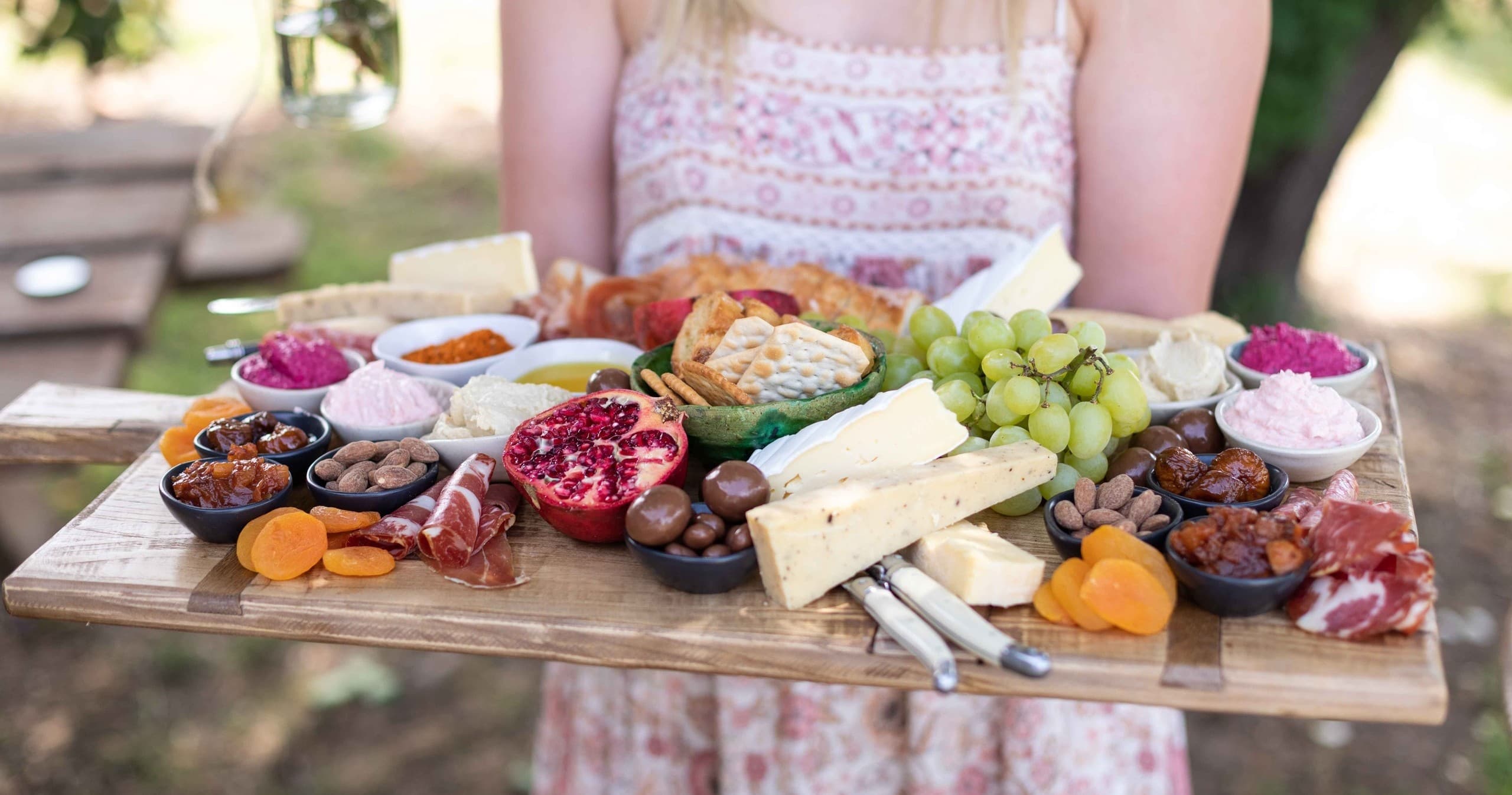 Outdoor charcuterie platter served at farm picnic near Heifer Station