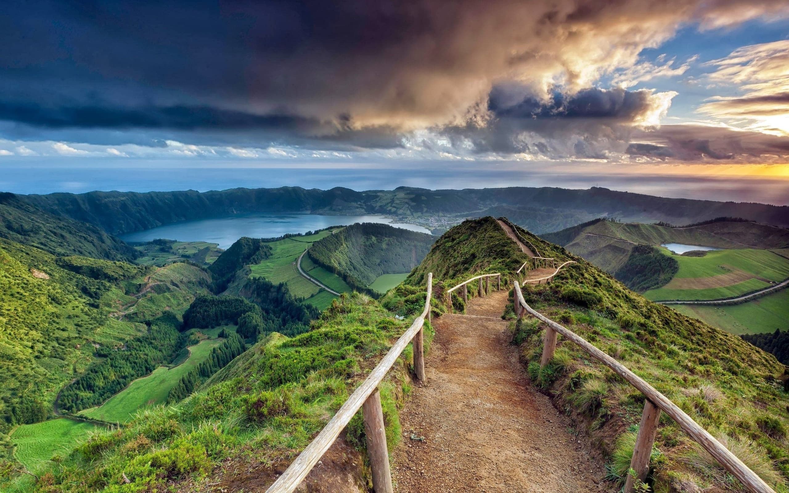 Sunlit volcanic crater lakes and ridgelines at dawn, Azores