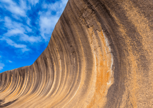Curved sandstone Wave Rock formation, hiking and photography site
