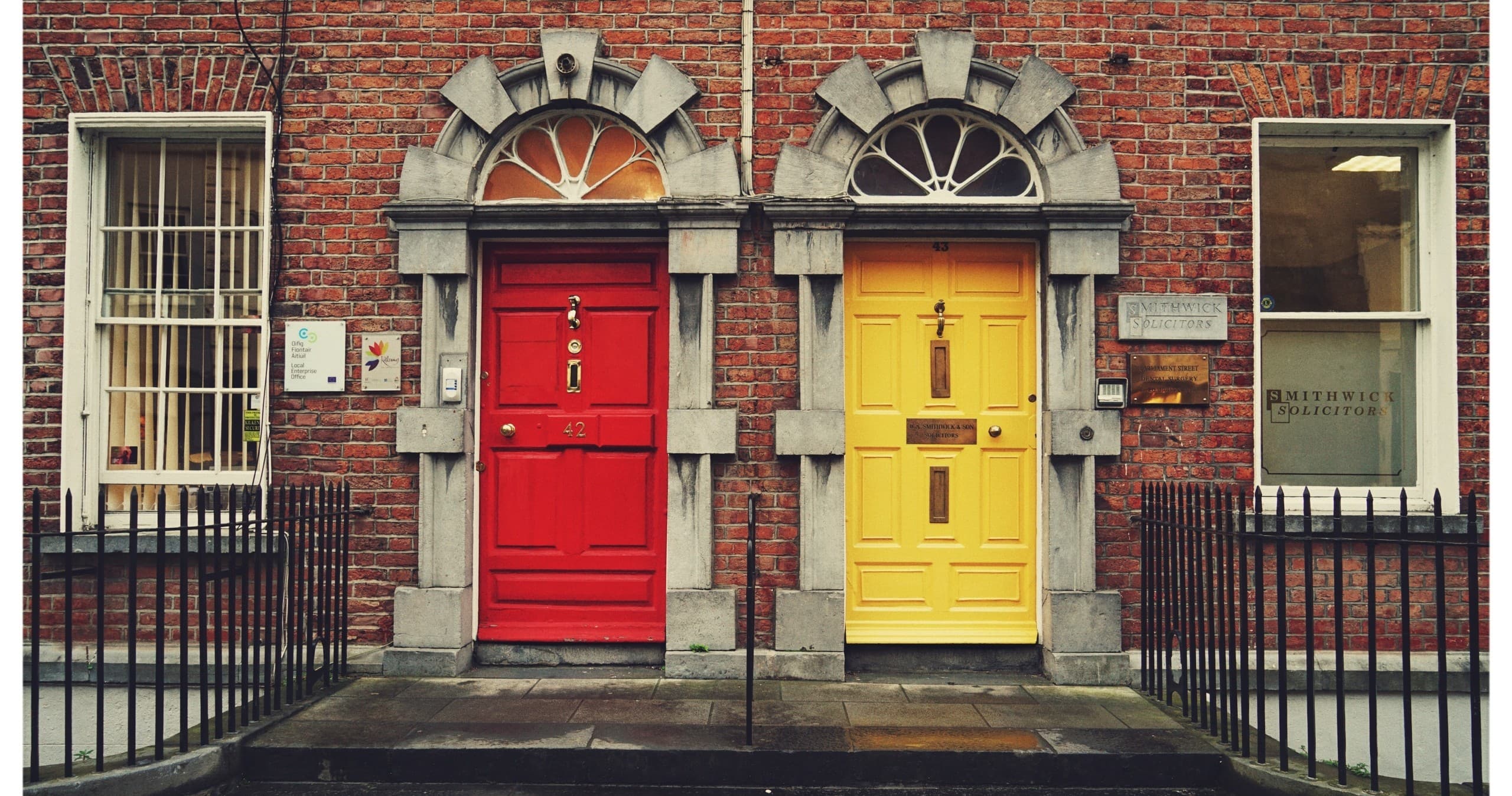 Colorful Georgian doorways on Dublin street during walking tour