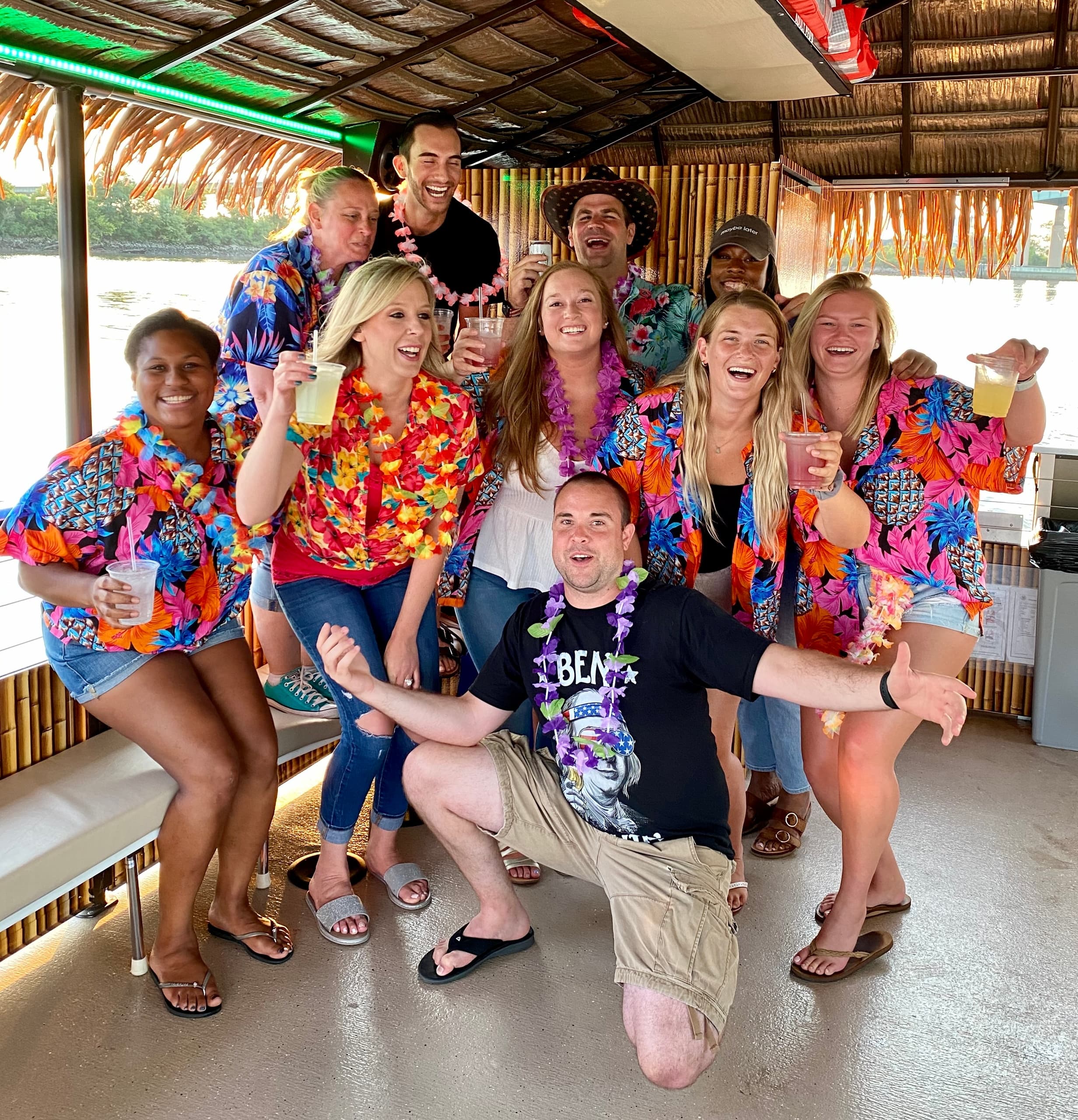 Lively tropical-themed party on cruise boat with drinks