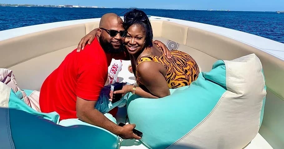 Couple relaxing on bow of charter boat with open ocean view