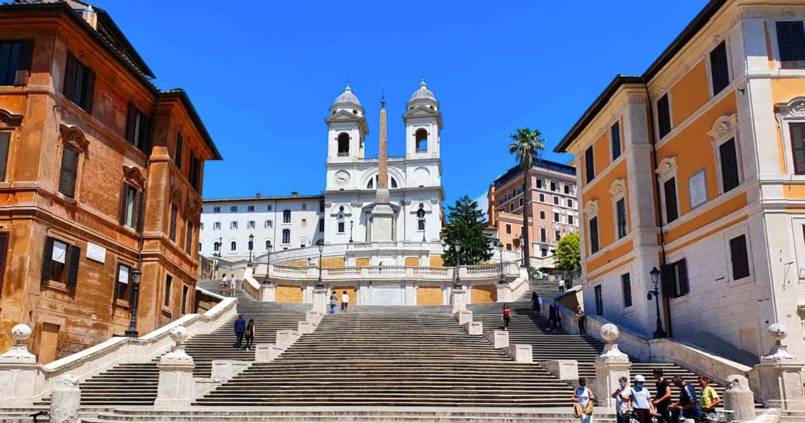 Visitors ascending the Spanish Steps with Trinita dei Monti church