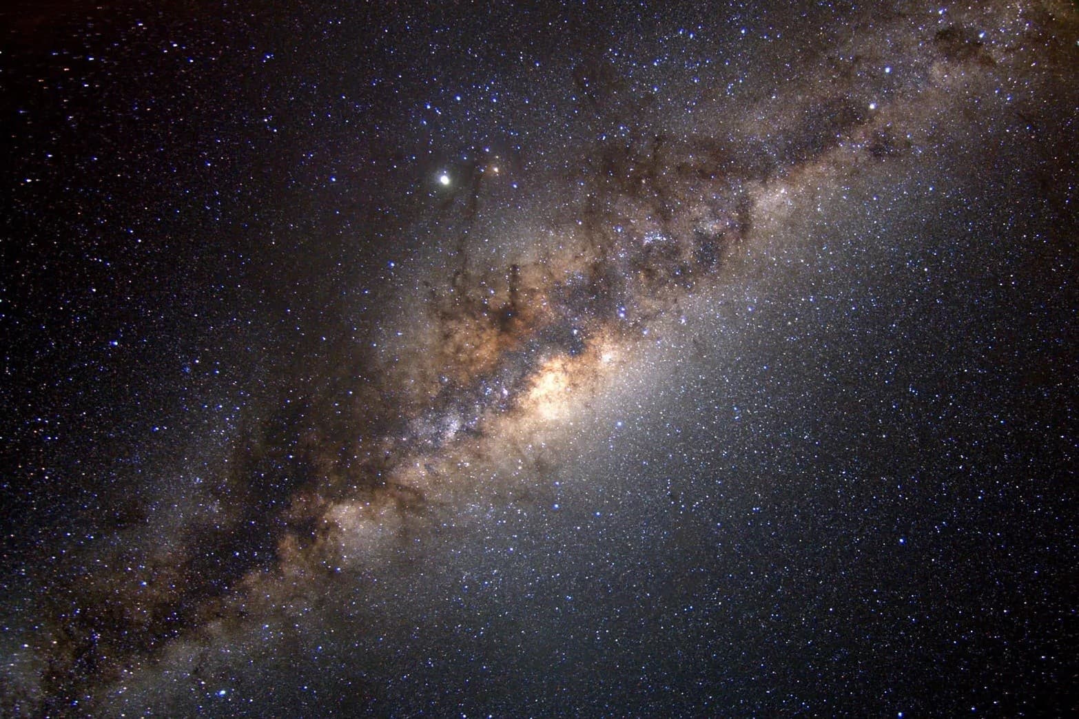 Night Milky Way panorama over mountain lake, stargazing view