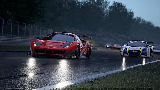 Sports cars racing on wet circuit during rainy track event